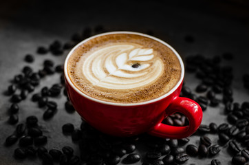 hot latte art in red mug