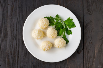 Cheese balls in crab shavings is a traditional Russian snack for Christmas and New Year's party