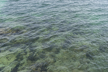 the calm sea, blue water texture with turquoise tones of the mediterranean sea on the island of Mallorca, Spain