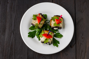 Grilled eggplants rolls with cream cheese, garlic and herbs