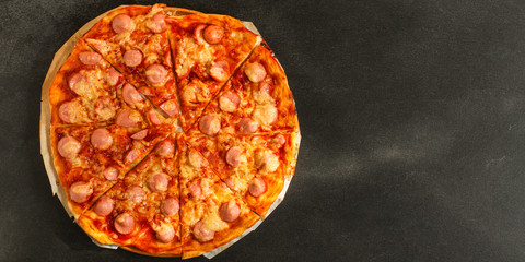 pizza with sausages (tomato sauce, cheese, meat). food background. top view. copy space