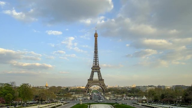 Scenic timelapse of famous Eiffel Tower in old touristic historic city Paris. Beautiful summer happy look of most popular touristic attraction in ancient capital of France