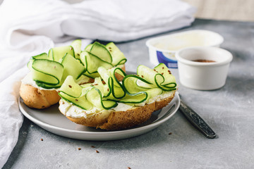 Sandwiches with cream cheese and cucumber.