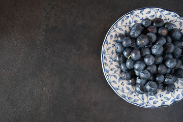 Fresh picked blueberries in a light and bright kitchen environment.