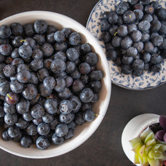 Fresh picked blueberries in a light and bright kitchen environment.