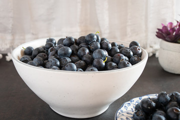 Fresh picked blueberries in a light and bright kitchen environment.