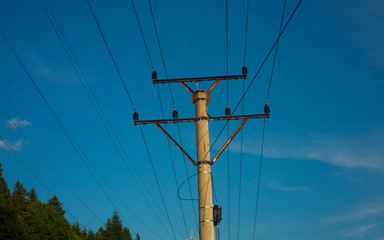 pole with wires, power and energy concept. clear blue sky