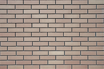 Distress old brick wall texture. Brick gray and beige colored background. Background brick texture. Design on the street.