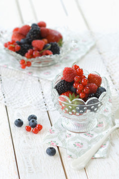 Glass bowl of various fresh fruits