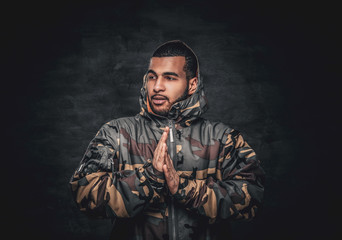 Black male dressed in a military jacket.