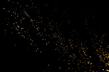 Gold abstract bokeh. Black background. Holyday concept