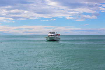 Mediterranean sea, moored tourist ship near the port, Monterosso, Cinque Terre, Italy