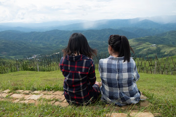 Fototapeta na wymiar Friendship between friends. Two women sitting at the view