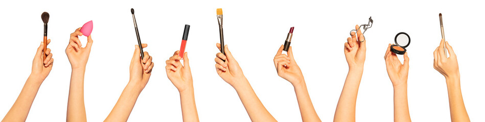 Hands with make-up brushes and beauty cosmetics