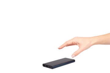 Hand with dark blue power bank for charging mobile devices, external battery.