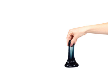 Hand with black slime toy for kids, glitters and goo.
