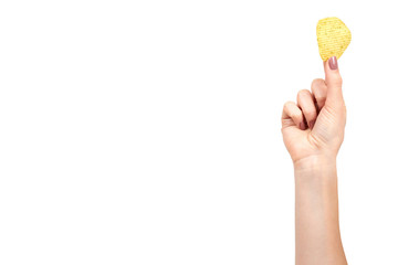 Hand with golden color potato chips, crunchy and wavy.