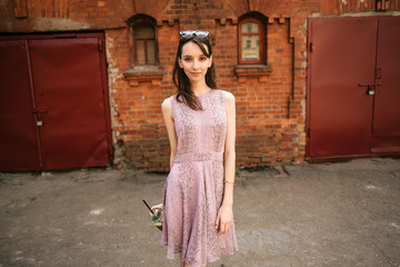 beautiful young girl in dress with lemonade outdoors, woman resting, walking on the street