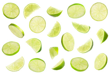 Set of flying cut fresh juicy lime on white background