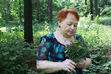 elderly woman park summer with flowers hands seniors grandma