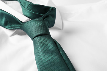 Color male necktie on white shirt, closeup - obrazy, fototapety, plakaty