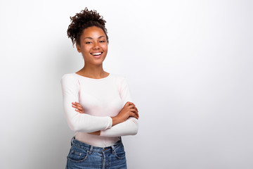 Happy girl folded her hands standing in studio. Concept gesture - Image