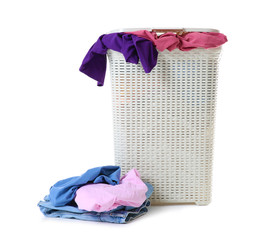 Laundry basket with dirty clothes isolated on white
