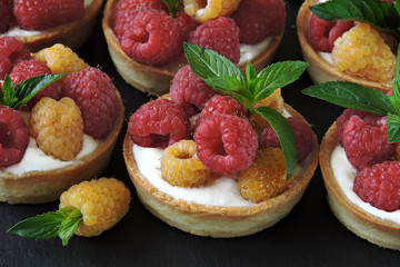 Desserts with raspberries. Tart with Greek yogurt and yellow and red raspberries. Keto diet. Keto desserts. Summer healthy dessert with yogurt and raspberries.