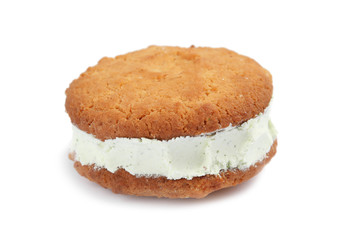 Sweet delicious ice cream cookie sandwich on white background