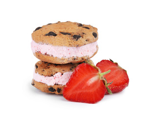 Sweet delicious ice cream cookie sandwiches and strawberry on white background