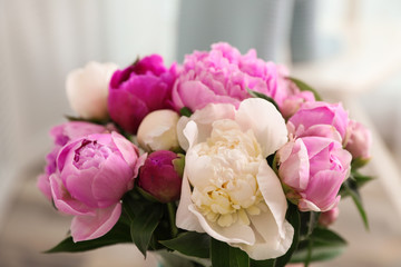 Bouquet of beautiful peonies on blurred background, closeup