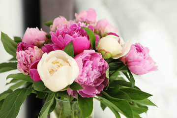 Bouquet of beautiful peonies on blurred background, closeup