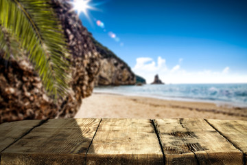 Summer desk of free space and blurred beach background 