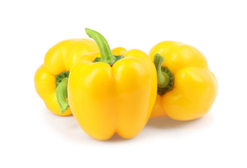 Ripe yellow bell peppers isolated on white