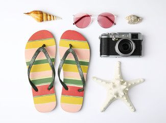 Flat lay composition with different beach objects on white background