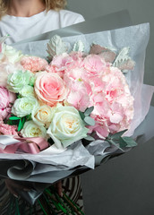 a large bouquet of flowers in their hands, a lush svabedny tender bouquet