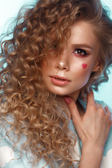Fototapeta premium Pretty girl with curls hairstyle, classic makeup, freckles, nude lips Beauty face.