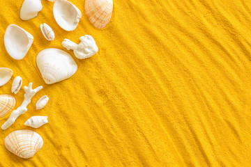 Seaside pattern with shells on yellow sand background top view mock up
