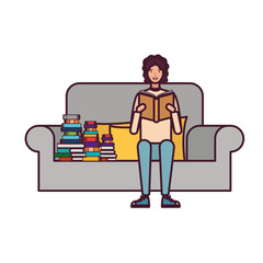 man sitting on chair with book in hands