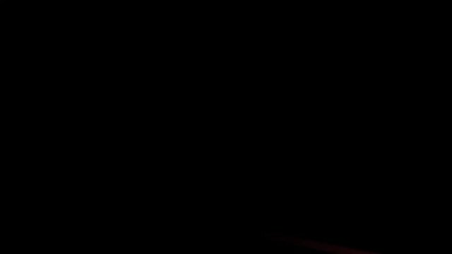 Bright orange neon glowing fast moving streams of light, along a trajectory. Fast energy flying wave line with flash lights. Animation magic swirl trace path on black background.