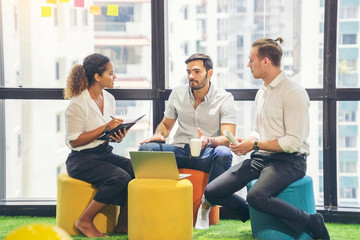  Friends, employees sitting in meetings and discussing work in the meeting room, office models, working