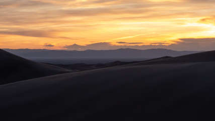 Sand, sunset, and mountains