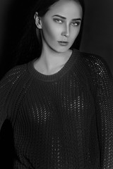 Portrait of a beautiful girl on a dark background.