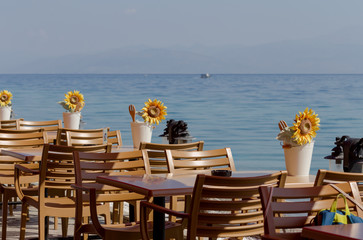 Wooden tables and chairs of a street cafe
