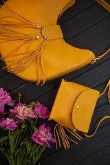 mustard color handbag with clutch flat lay