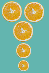 slices of orange on turquoise background