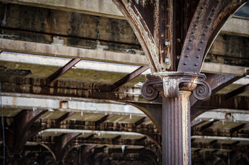 Iron column showing turn of the century details in an old abandoned railroad station