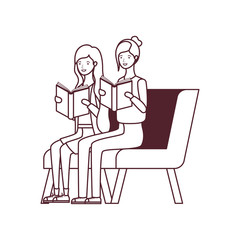 women sitting on chair with book in hands