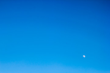 clear view of moon and blue sky