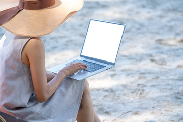 Young adult women traveler in mini dress sitting on beach chair in tropical island sand beach in...